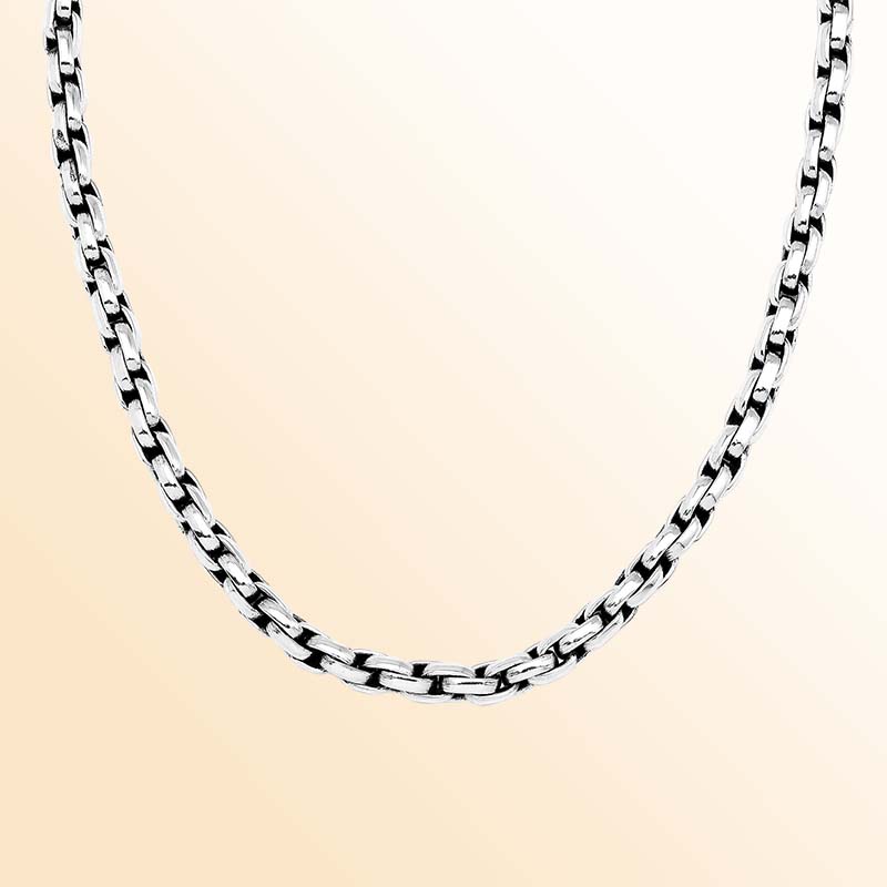 Artisan sterling silver necklace showcasing smooth rounded box links, luminous polished surfaces, subtle oxidized depth, and a refined decorative push clasp.