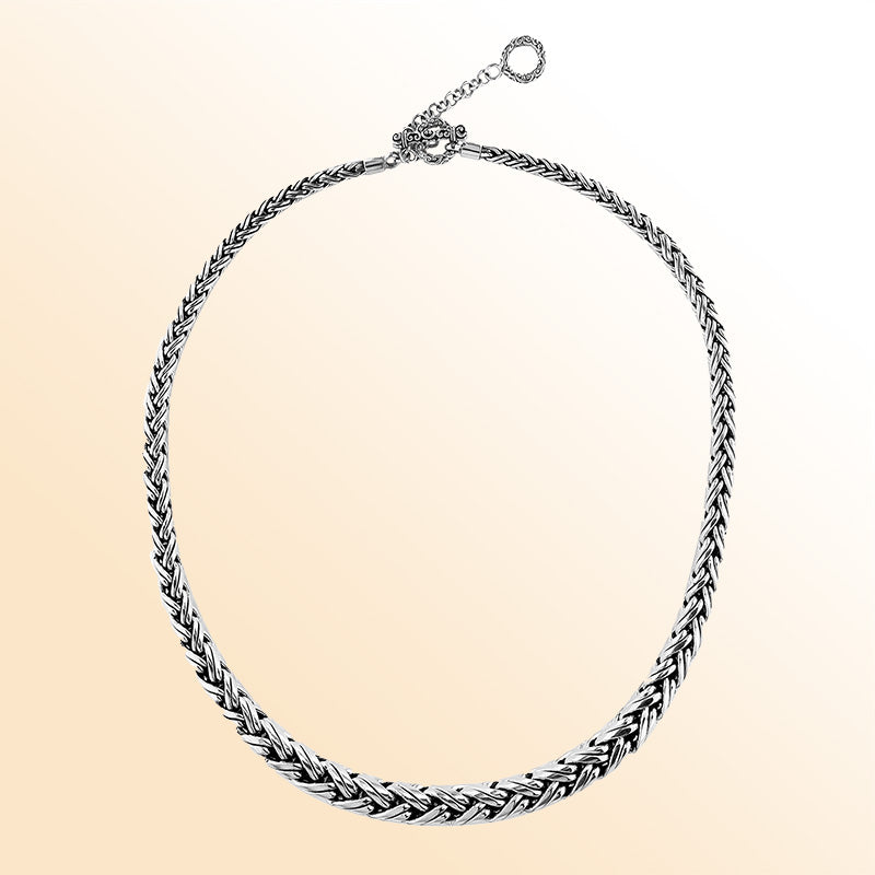Handcrafted sterling silver graduated necklace with woven design, polished-oxidized finish, and artisan clasp, made in Bali.