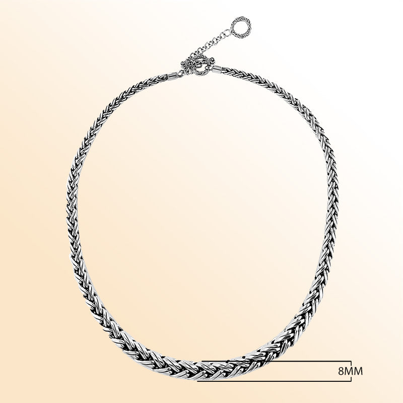 Handcrafted sterling silver graduated necklace with woven design, polished-oxidized finish, and artisan clasp, made in Bali.