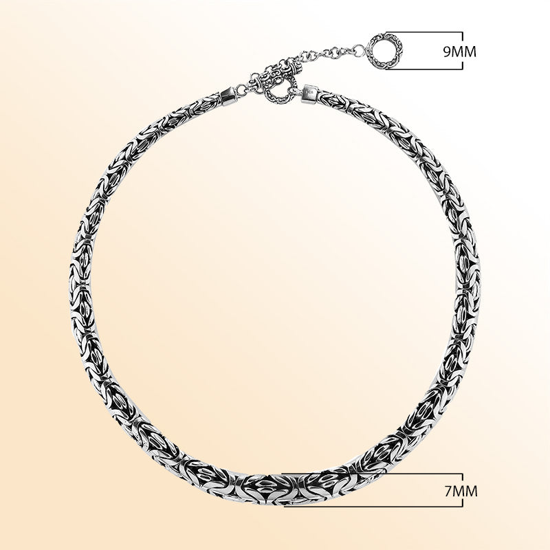Handcrafted sterling silver graduated woven necklace with intricate design, polished-oxidized finish, and artisan clasp, made in Bali.