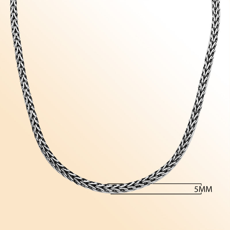 Handcrafted sterling silver woven necklace with polished-oxidized finish and artisan box clasp, made in Bali.
