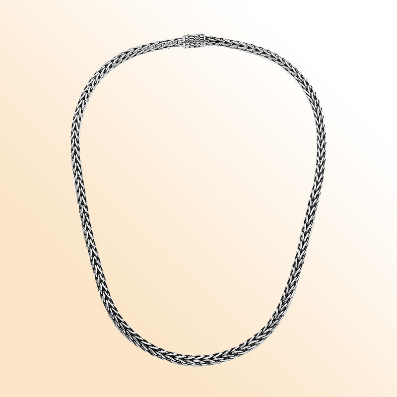 Handcrafted sterling silver woven necklace with polished-oxidized finish and artisan box clasp, made in Bali.