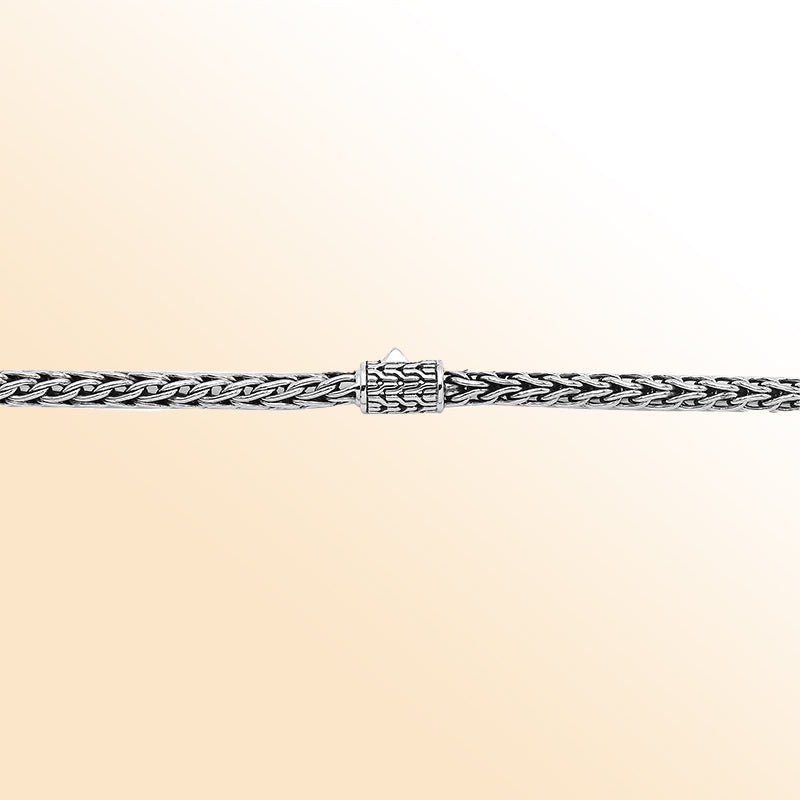 Handcrafted sterling silver woven necklace with polished-oxidized finish and artisan box clasp, made in Bali.
