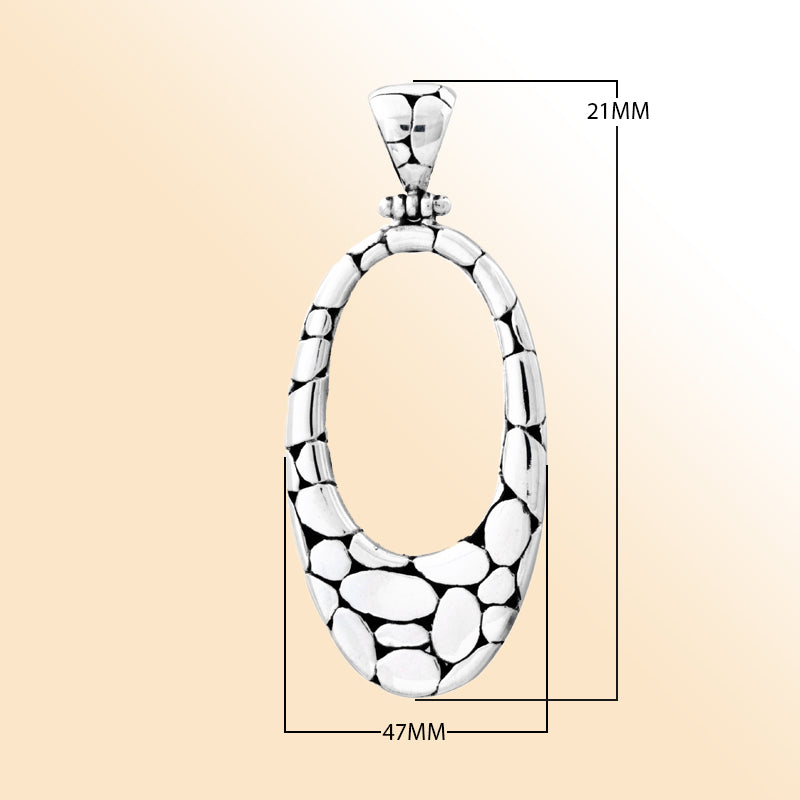 Elegant sterling silver oval pendant with unique pebble texture, handcrafted Bali jewelry for everyday wear.