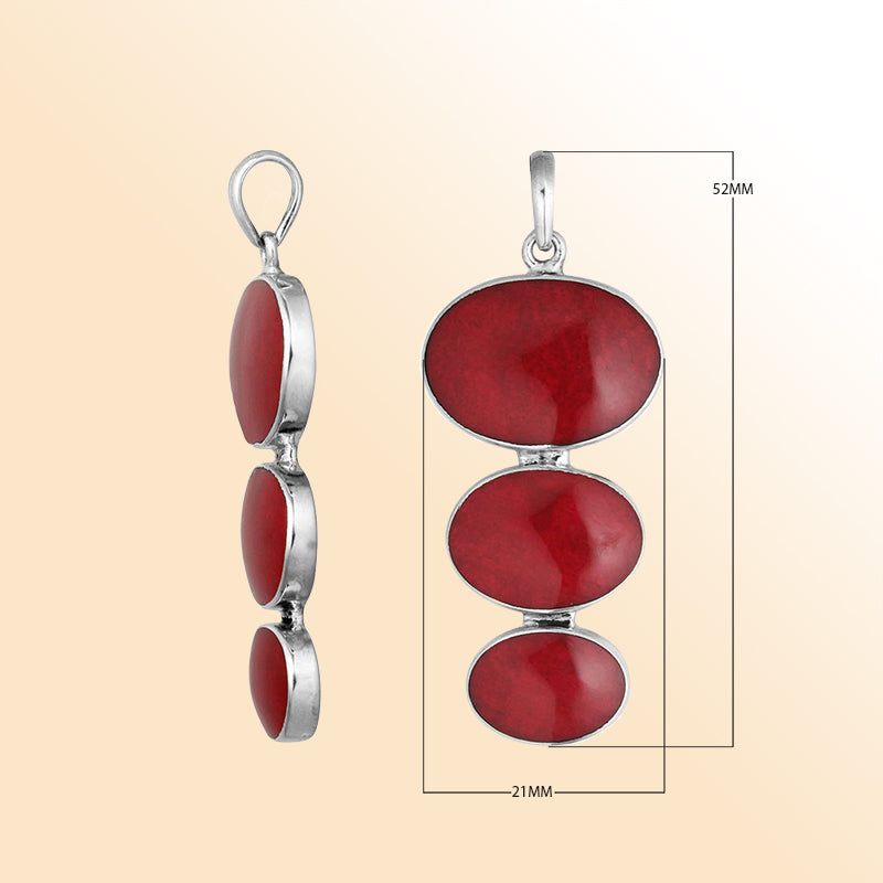 Handcrafted sterling silver pendant with three oval red coral stones, artisan Bali jewelry for elegant everyday wear.   