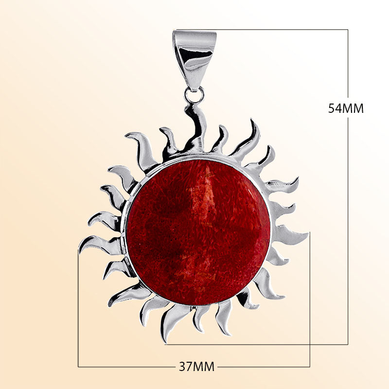 Handcrafted sterling silver sun pendant with vibrant red coral centerpiece, artisan Bali jewelry for bold everyday style.