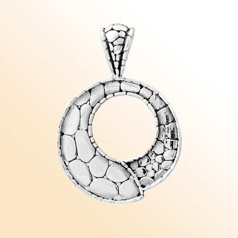 Handcrafted sterling silver round pendant with pebble-textured design and open circle center, artisan Bali jewelry for everyday elegance.