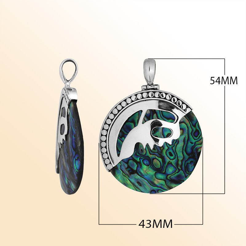 Handcrafted sterling silver round pendant with vibrant abalone shell inlay and unique silver overlay, artisan Bali jewelry with ocean-inspired shimmer.