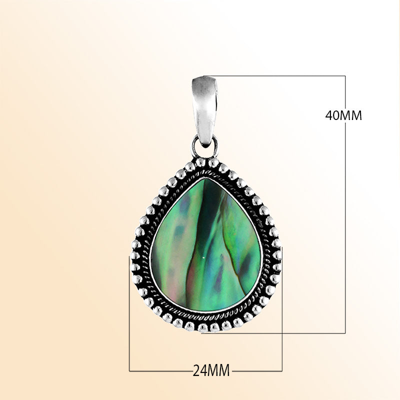 Handcrafted sterling silver pear-shaped pendant with vibrant abalone shell centerpiece, accented with a granulated rope design, artisan Bali jewelry for everyday elegance.