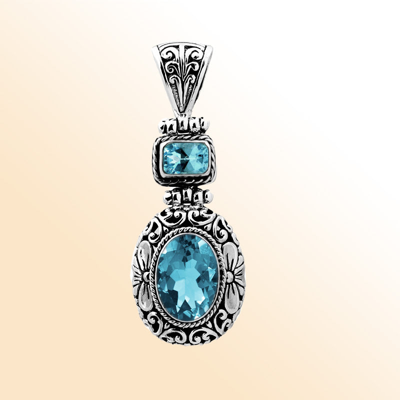 Sterling silver Blue Topaz pendant with oval and square Quartz, detailed Bali filigree silverwork and oxidized finish, handcrafted artisan jewelry for women.