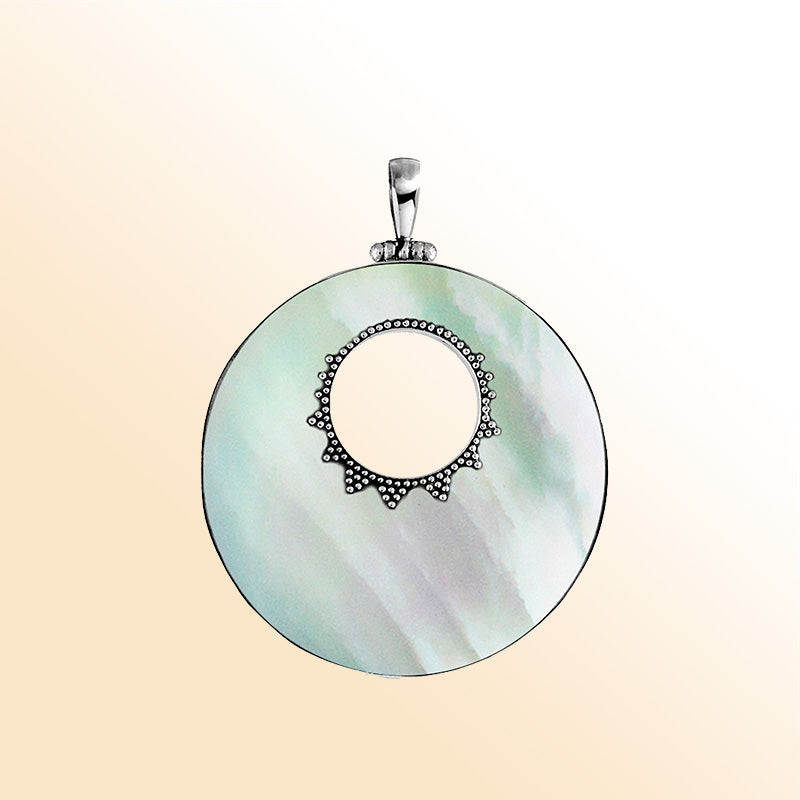 Sterling silver round Mother of Pearl pendant with center cut-out and Bali-inspired beaded detailing, handcrafted artisan jewelry for women.