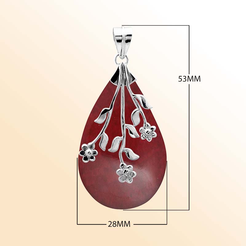 Elegant Sterling Silver Red Coral teardrop pendant with handcrafted floral branch overlay, mirror-polished high-gloss finish, and artistic Balinese design for women’s jewelry collections.