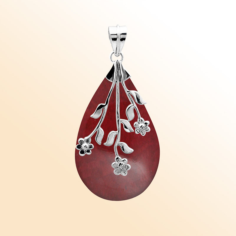 Elegant Sterling Silver Red Coral teardrop pendant with handcrafted floral branch overlay, mirror-polished high-gloss finish, and artistic Balinese design for women’s jewelry collections.