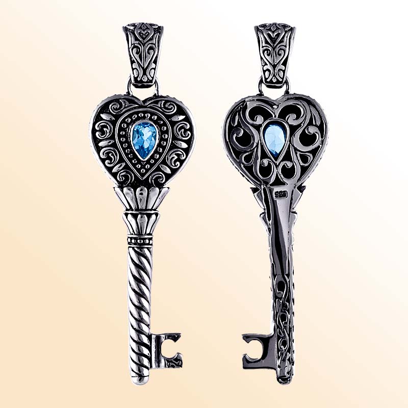Sterling silver heart key pendant with genuine blue topaz gemstone and detailed Balinese scrollwork, handcrafted artisan jewelry for gifting or everyday wear.
