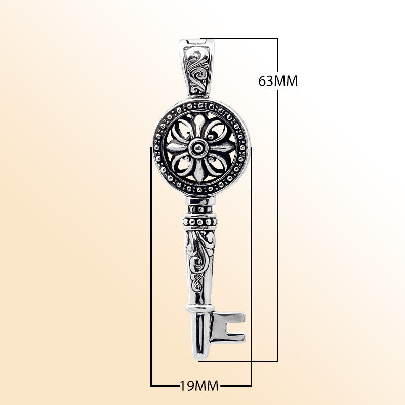Sterling silver key pendant with handcrafted Bali floral design – symbolic jewelry gift of love, luck, and new beginnings