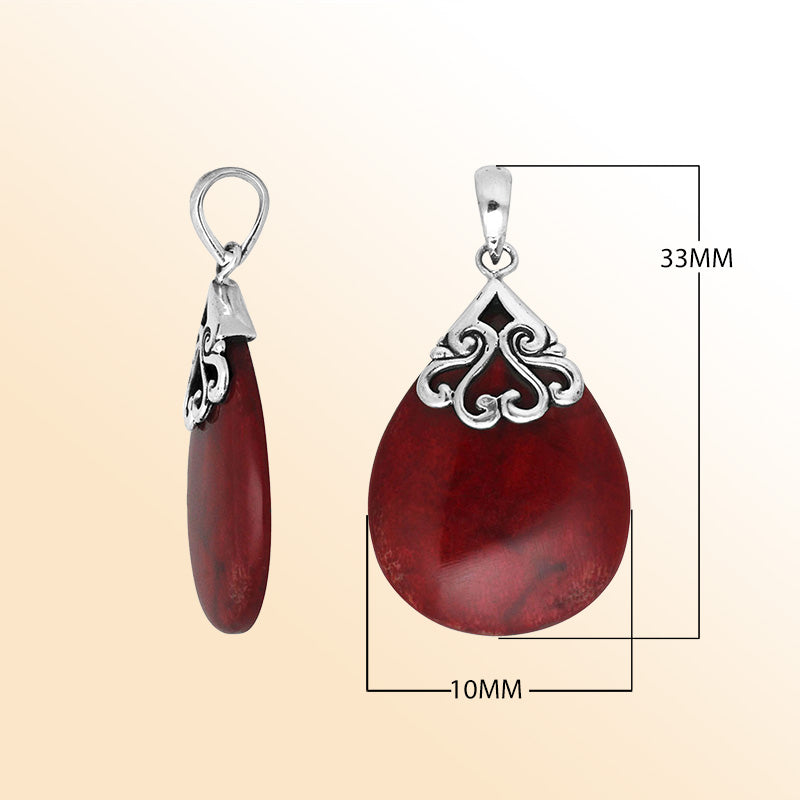 Sterling silver teardrop pendant with natural Red Coral – handcrafted Bali jewelry with elegant scrollwork, a bold and meaningful gift