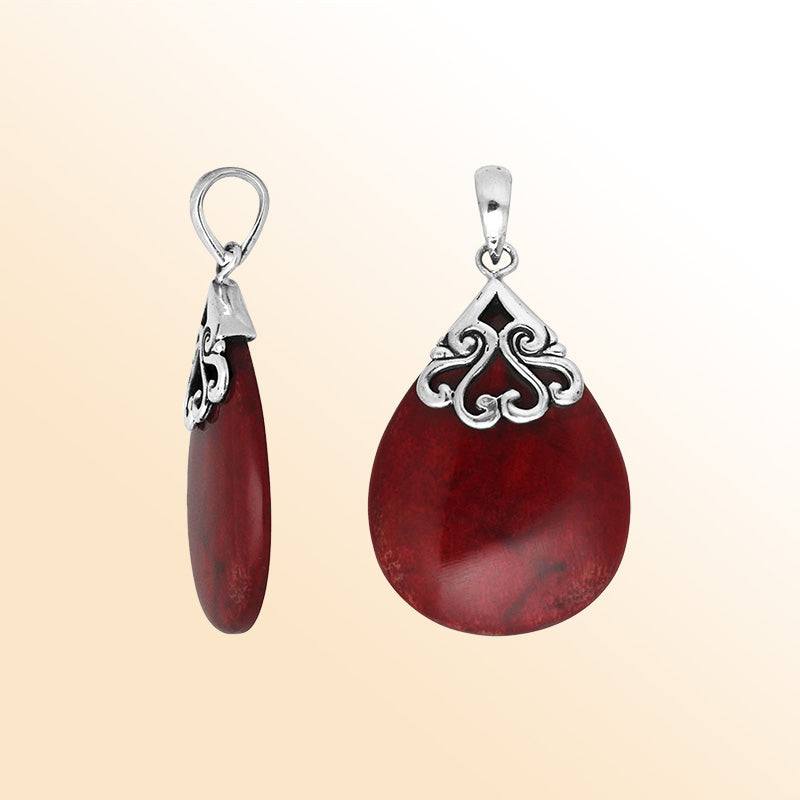 Sterling silver teardrop pendant with natural Red Coral – handcrafted Bali jewelry with elegant scrollwork, a bold and meaningful gift
