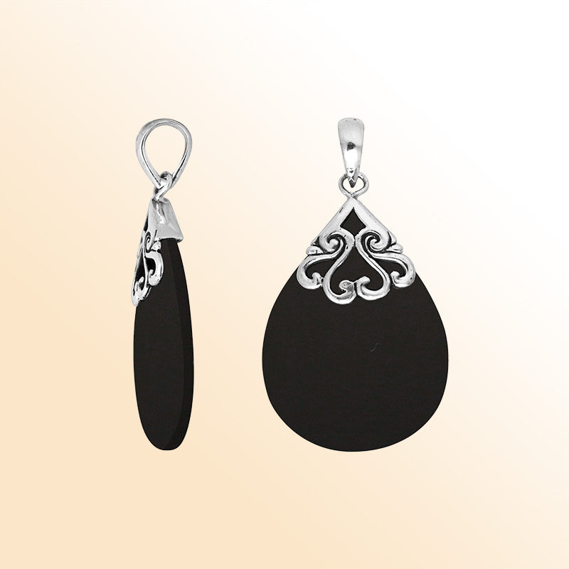 Sterling silver teardrop pendant with polished Black Shell – handcrafted Bali jewelry with elegant scrollwork, a bold and timeless gift