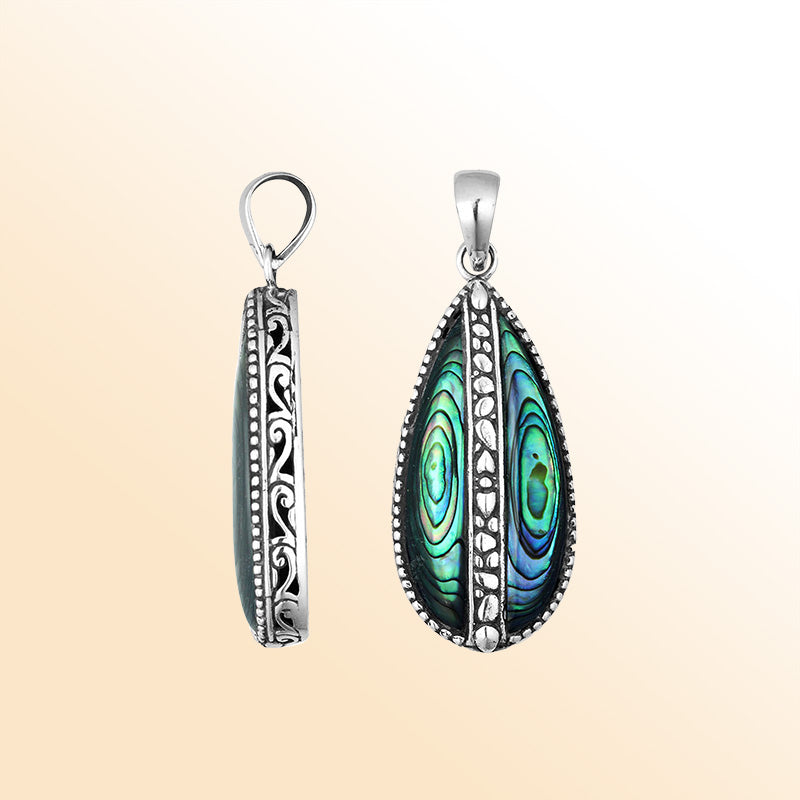 Sterling silver teardrop pendant with shimmering abalone shell – handcrafted Bali jewelry, a unique ocean-inspired gift