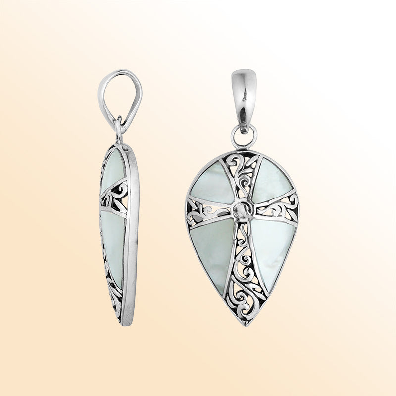Sterling silver teardrop cross pendant with luminous Mother of Pearl – handcrafted Bali jewelry, a meaningful gift