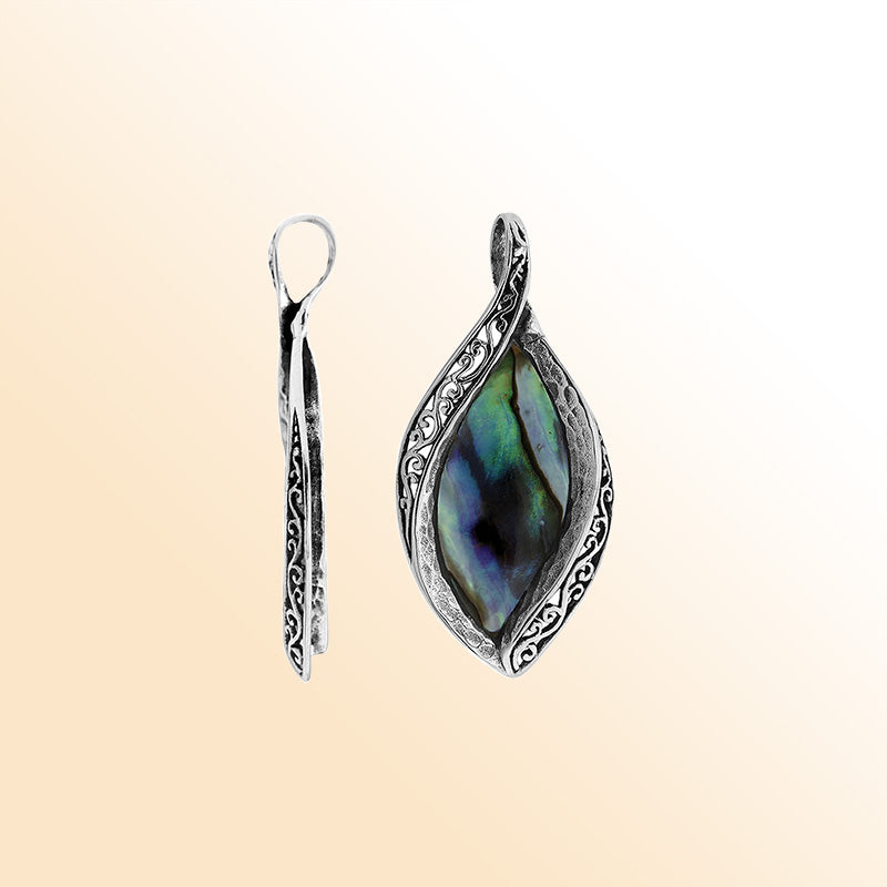 Sterling silver marquise pendant with abalone shell inlay and detailed Balinese carving, handcrafted in Bali.