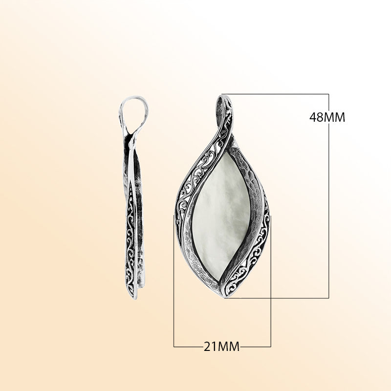 Sterling silver marquise pendant with luminous Mother of Pearl inlay and detailed Balinese carving, handcrafted in Bali.