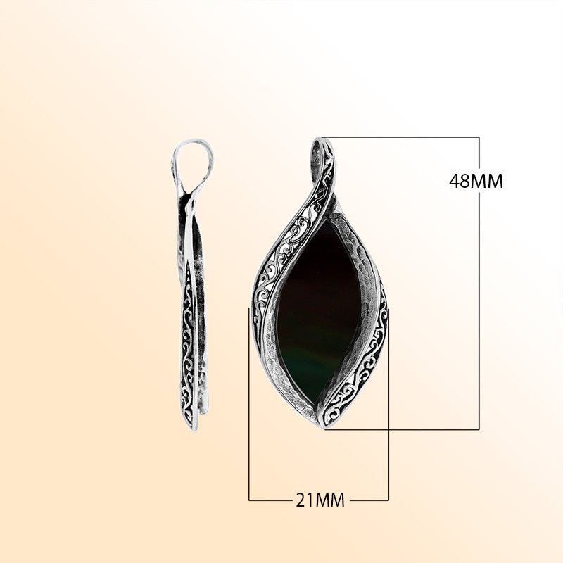 Sterling silver marquise pendant with black shell inlay and ornate Balinese carving, handcrafted in Bali.