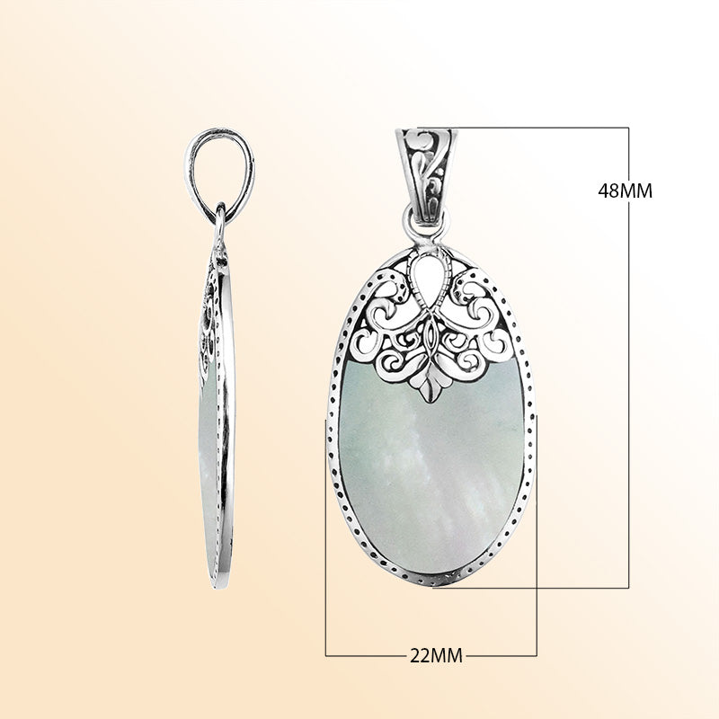 Sterling silver oval pendant with luminous Mother of Pearl inlay and delicate Balinese filigree design, handcrafted in Bali.