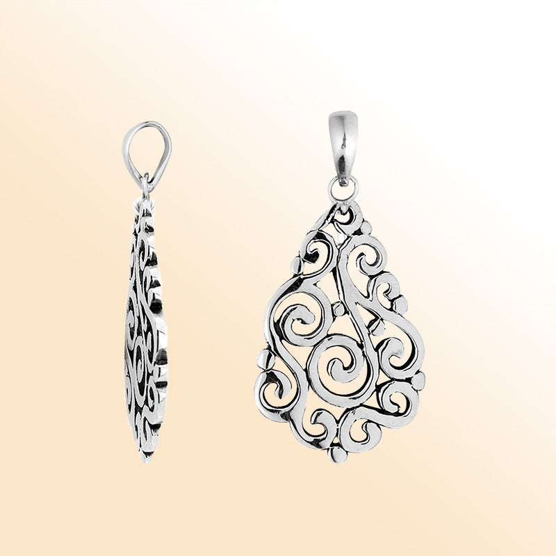 Sterling silver teardrop pendant with elegant swirl filigree design, handcrafted Bali artisan jewelry for everyday and special occasion wear.