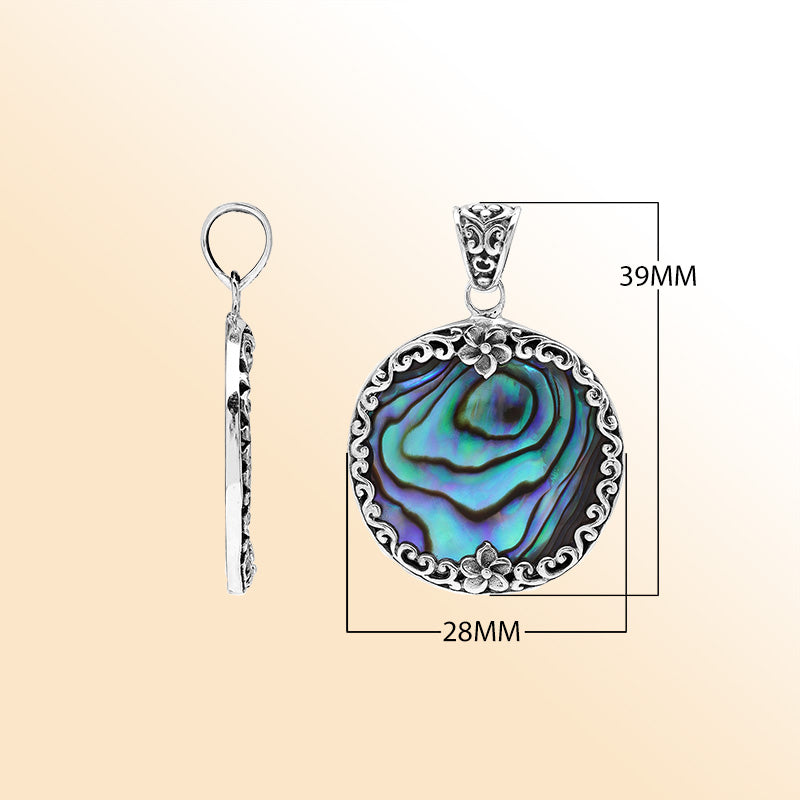 Sterling silver round pendant with shimmering abalone shell and floral detailing, handcrafted Bali artisan jewelry for elegant everyday wear.