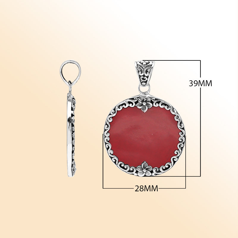 Sterling silver pendant with round red coral gemstone and floral Bali frame, handcrafted artisan jewelry for elegant everyday wear.