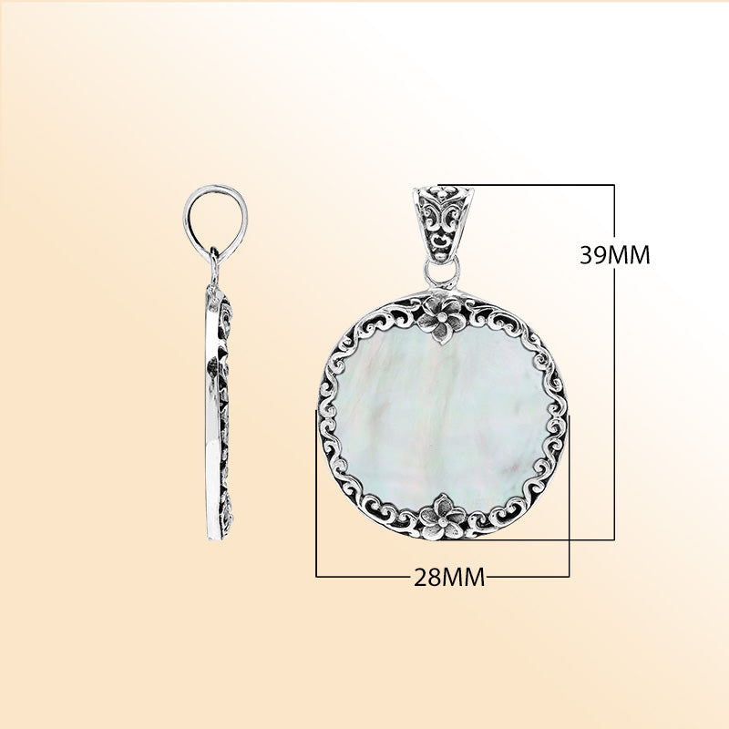 Sterling silver round pendant with luminous mother of pearl and floral Bali frame, handcrafted artisan jewelry for elegant everyday wear.