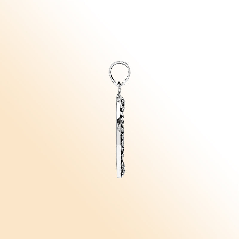 Sterling silver round pendant with glossy black shell and floral Bali detailing, handcrafted artisan jewelry for elegant everyday wear.