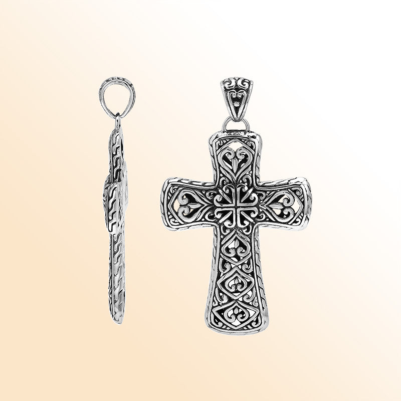 Handcrafted sterling silver ornate cross pendant with detailed Balinese scrollwork, elegant artisan jewelry for unisex.