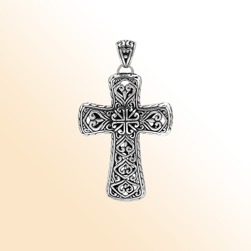Handcrafted sterling silver ornate cross pendant with detailed Balinese scrollwork, elegant artisan jewelry for unisex.