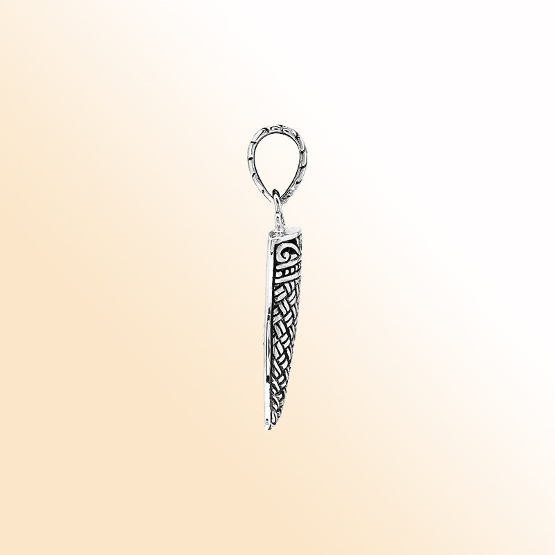 Handmade sterling silver tribal tooth pendant with detailed Balinese engravings, bold artisan unisex jewelry from Bali.