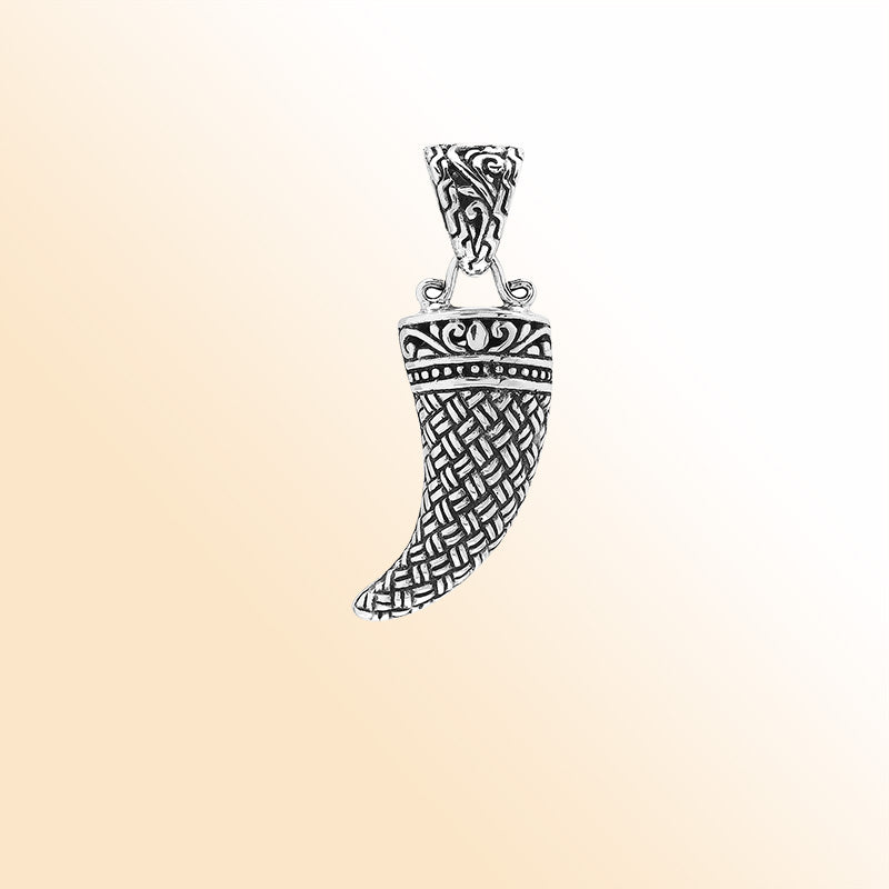 Handmade sterling silver tribal tooth pendant with detailed Balinese engravings, bold artisan unisex jewelry from Bali.