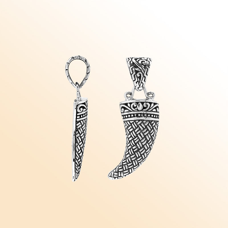 Handmade sterling silver tribal tooth pendant with detailed Balinese engravings, bold artisan unisex jewelry from Bali.