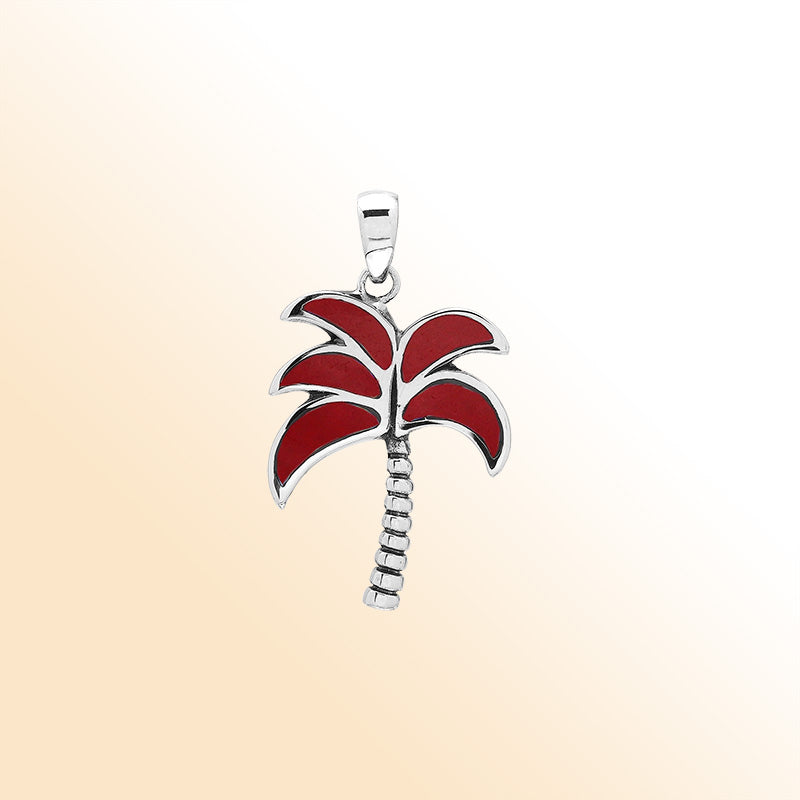 Bold tropical palm tree pendant in sterling silver with coral inlay, artisan-crafted for vibrant beach-inspired style.