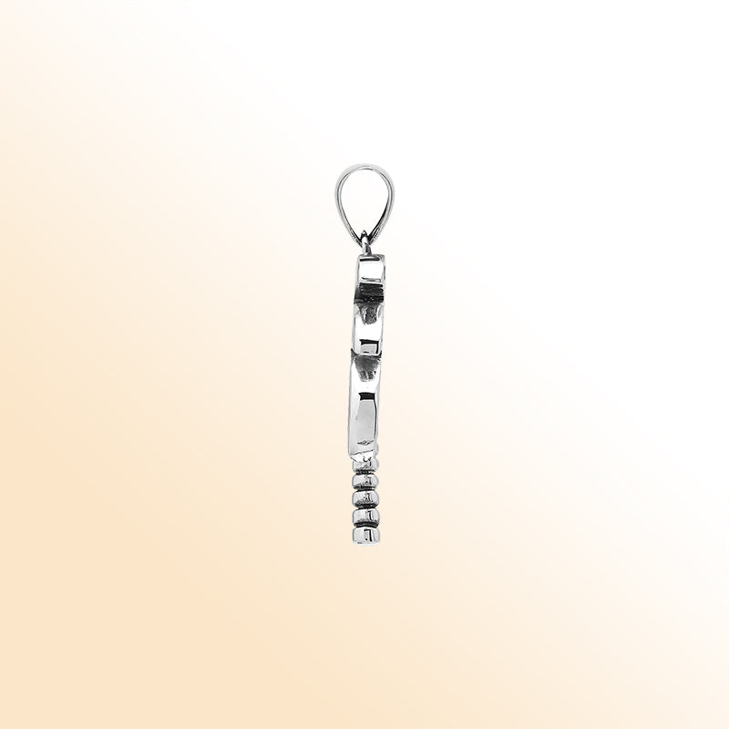 Sleek palm tree pendant in sterling silver with black shell inlay and textured trunk, artisan-crafted for modern tropical style.