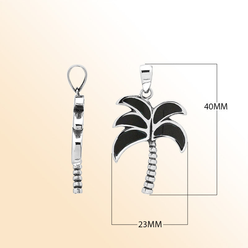 Sleek palm tree pendant in sterling silver with black shell inlay and textured trunk, artisan-crafted for modern tropical style.