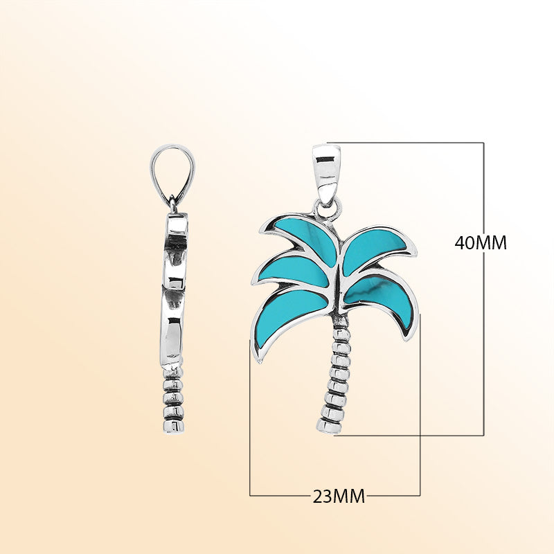 Vibrant sterling silver palm tree pendant with turquoise shell inlay and textured trunk, artisan-crafted for tropical beach style.