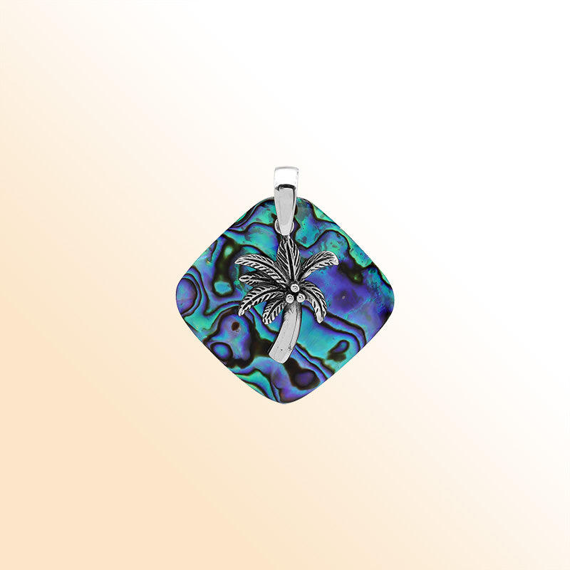 Statement palm tree pendant in sterling silver with abalone shell diamond backdrop, artisan-crafted for bold tropical style.