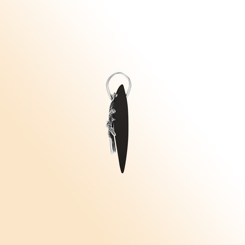 Sleek sterling silver palm tree pendant with black shell diamond base, artisan-crafted for modern tropical style.