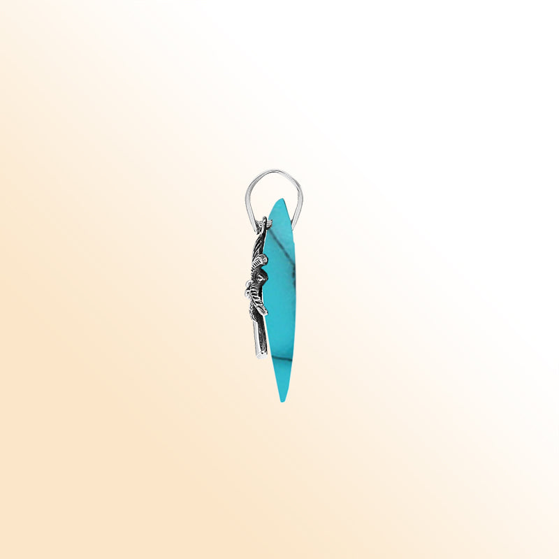 Vibrant sterling silver palm tree pendant with turquoise shell diamond base, artisan-crafted for bold tropical beach style.