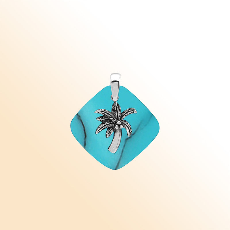 Vibrant sterling silver palm tree pendant with turquoise shell diamond base, artisan-crafted for bold tropical beach style.