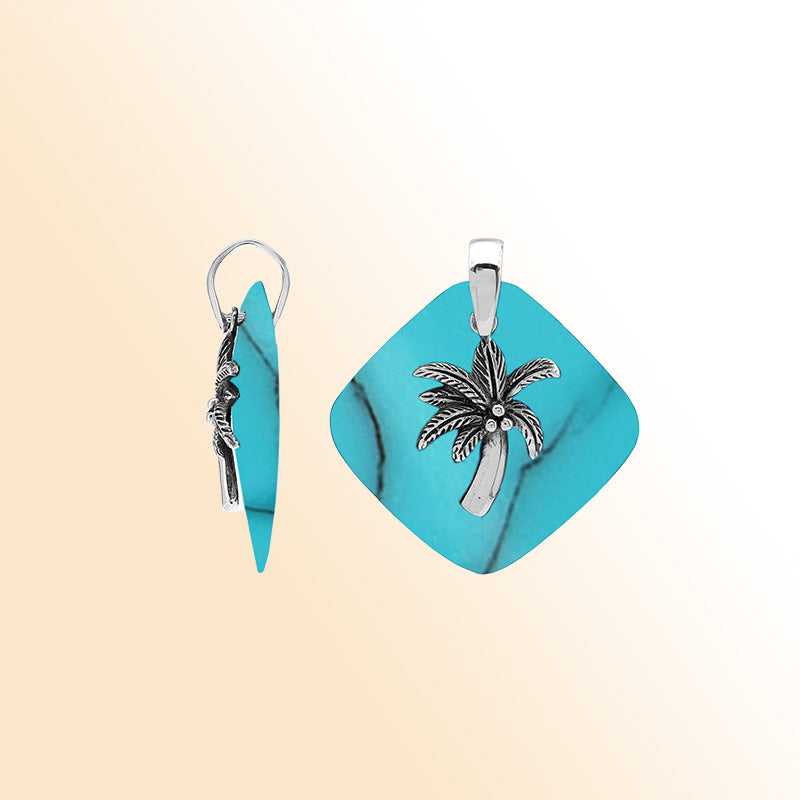 Vibrant sterling silver palm tree pendant with turquoise shell diamond base, artisan-crafted for bold tropical beach style.