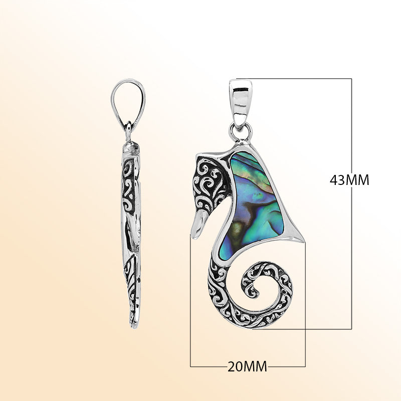 Ocean-inspired sterling silver seahorse pendant with abalone shell inlay, artisan-crafted for tropical marine jewelry style.