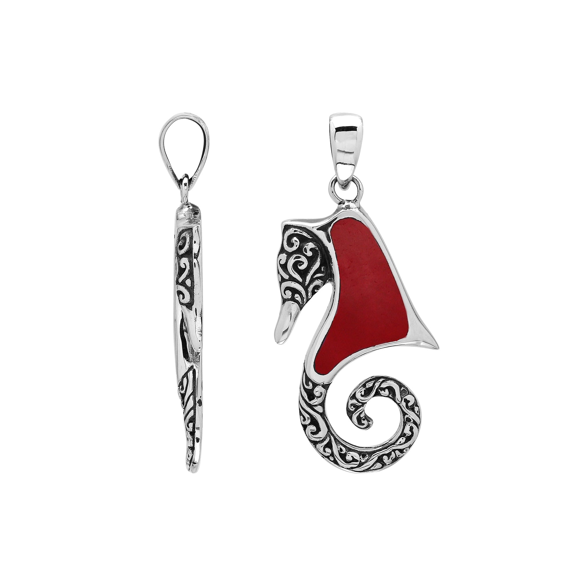 Bold sterling silver seahorse pendant with coral inlay, artisan-crafted for tropical ocean-inspired style.