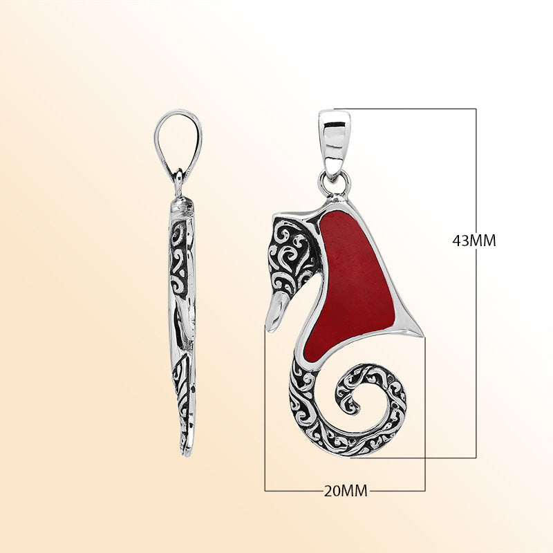 Bold sterling silver seahorse pendant with coral inlay, artisan-crafted for tropical ocean-inspired style.